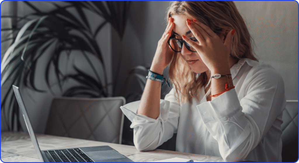 woman stress with a HR headache because she's not using a monthly design subscription